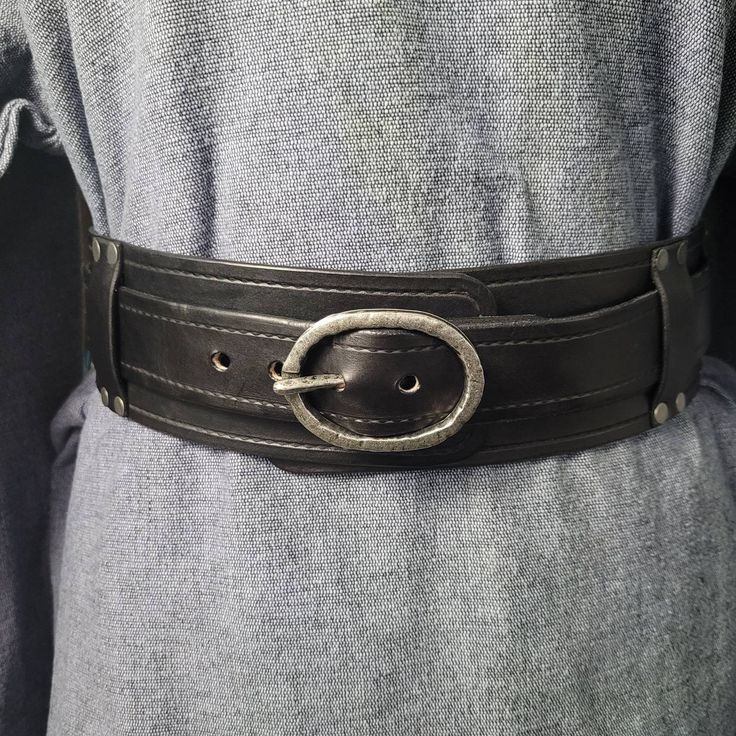 "Black 3\" Inch Leather battle belt for Viking, Cosplay or Larp costuming.  (1) 1.5\" rugged silver buckle and rivets. Belt separates from the under belt. 2 belts in one. Hang sword or axe frogs, mug or skirt rings.  * NOTE: Measure your actual waist size without bulk of layers of clothing- I will add an additional 4\" for later growth and or clothing." Viking Cosplay, Battle Belt, Wide Leather Belt, Utility Belt, Black Leather Belt, Suspender Belt, Larp, Black Belt, Rivets