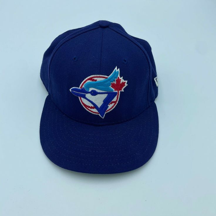 About this item Condition: Used: Seller Notes: “Pre-owned item in good condition” Brand: New Era Cap is a brand with an authentic sports heritage with Variety of Caps/Hats Sport: Baseball-MLB Size: 7 1/4 Color: Blue Product: Cap, Hat Team: Toronto Blue Jays Canadian Baseball team based out in Toronto. Compete in Major League Baseball Gender: Men Blue Fitted Hat For Baseball Season, Collegiate Blue Six-panel Baseball Cap, Blue Collegiate Six-panel Baseball Cap, Collegiate Blue Flat Bill Baseball Cap, Blue Six-panel Snapback Hat For Sports Events, Blue Six-panel Fitted Hat For Sports Events, Blue Throwback Snapback Hat For Sports, Throwback Blue Hats For Sports Events, Blue Baseball Fan Merchandise Hats