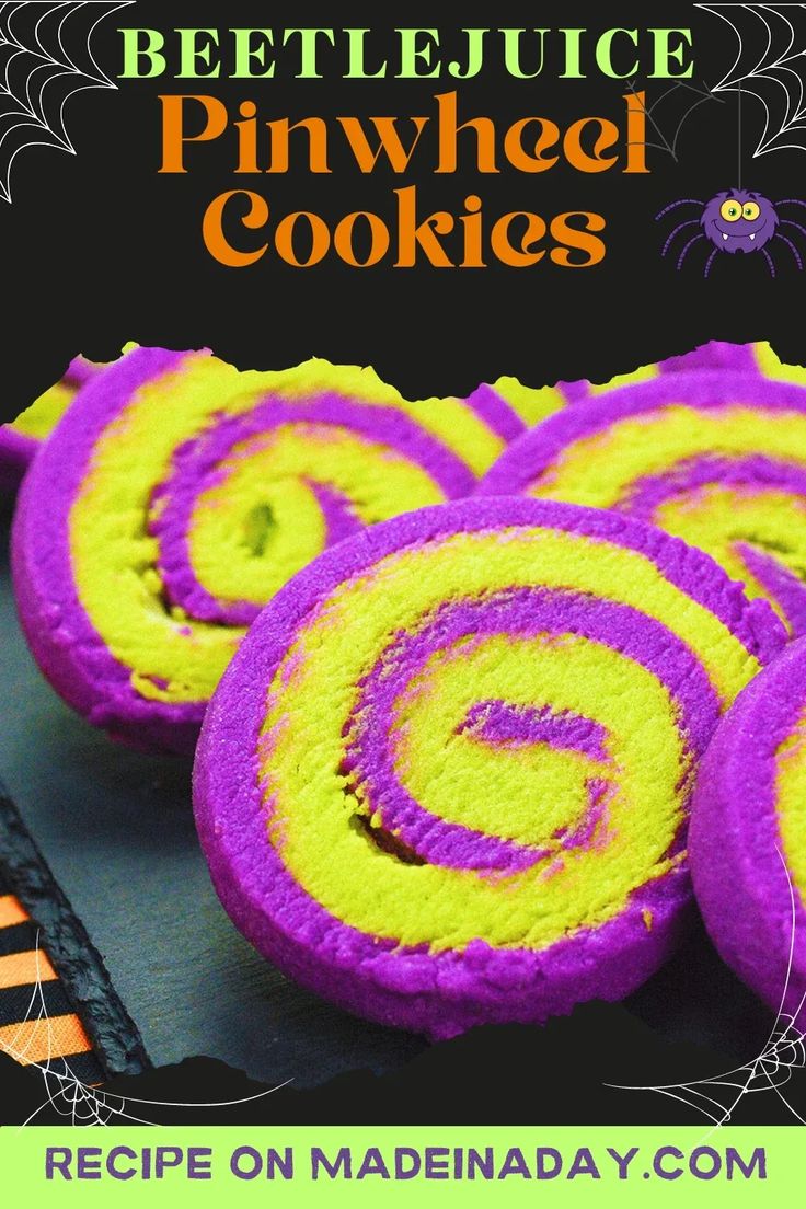 halloween cookies with purple and yellow icing on them