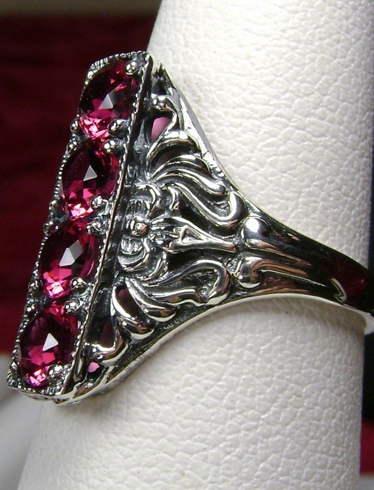 "Simulated Red Ruby Ring Description 4Gem Design#72 MADE TO ORDER This is a lovely late Victorian, early Edwardian, era reproduction ring in antiqued solid sterling silver. The gorgeous filigree ring is set with 4 round cut man-made/sim ruby red gemstones. The simulated red ruby gemstones are 4mm in diameter. This filigree setting is a revival of an authentic Antique ring; notice the amazing etched band... The ring sits 3/4th\" (19mm) NS on the finger. The quality the ring is simply breathtaking Red Ruby Ring, Mystic Fire Topaz, Order Design, Antique Ring, Red Gemstones, Red Band, Sterling Silver Filigree, Mystic Topaz, Edwardian Era