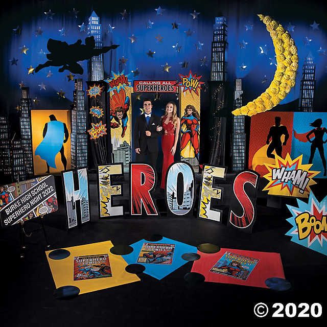 there is a man and woman standing in front of the word hero's surrounded by comic books