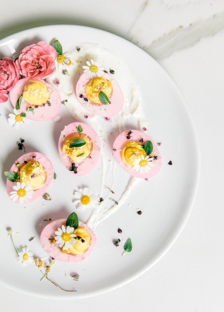 an instagram page with flowers and deviled eggs on a white plate, along with the caption