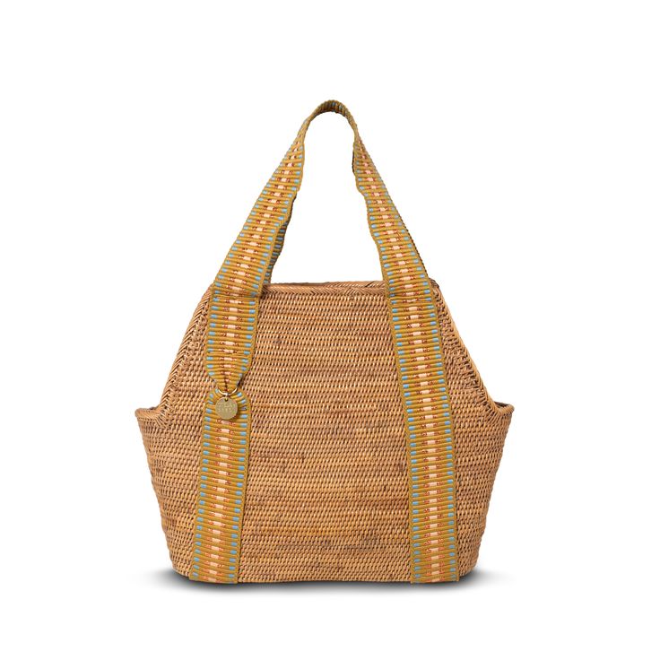 This handwoven vegan basket bag has been crafted in a contemporary silhouette using robust organic and locally grown Balinese atta grass. The internal cotton canvas lining meets in a drawstring closure to keep your essentials secure, and it's finished with our signature jacquard handles in eye-catching copper stripe. Resort Accessories, Belt Purse, Handcrafted Accessories, Locally Grown, Phone Pouch, Basket Bag, Balinese, Shopper Bag, Luxury Handbags