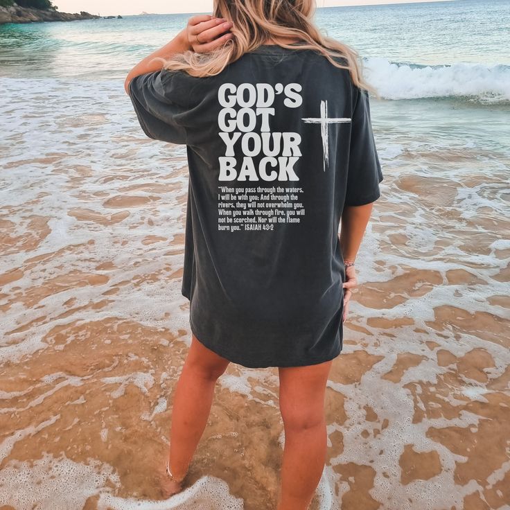 Isaiah Shirt, Comfort Colors God's Got Your Back Shirt, Christian Shirt, Jesus T-Shirt, Bible Verse Tee, Isaiah 43, Christian tshirts women GOD'S GOT YOUR BACK ❤ When you pass through the waters, I will be with you; and through the rivers, they shall not overwhelm you; when you walk through fire you shall not be burned, and the flame shall not consume you. PLEASE NOTE THIS IS A BACK PRINT DESIGN ONLY. THE FRONT IS PLAIN ❤️ ✦ FEATURES ✦ ✿  What makes these t-shirts so special? Well, there's an ar Cool Christian Tshirts, Cross Tshirt Designs, Godly Shirts, Christian T Shirt Ideas, Scripture Clothing, Jesus T Shirts, Christmas Sweatshirt Ideas, Christian Wear, Walk Through Fire