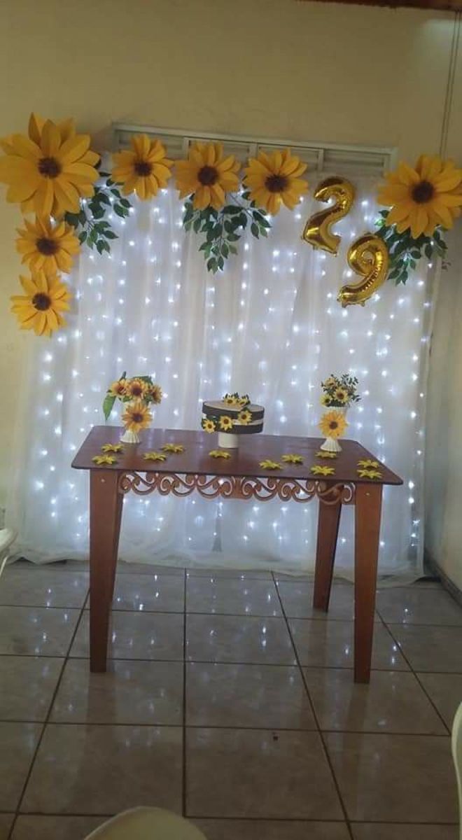 the table is decorated with sunflowers and decorations