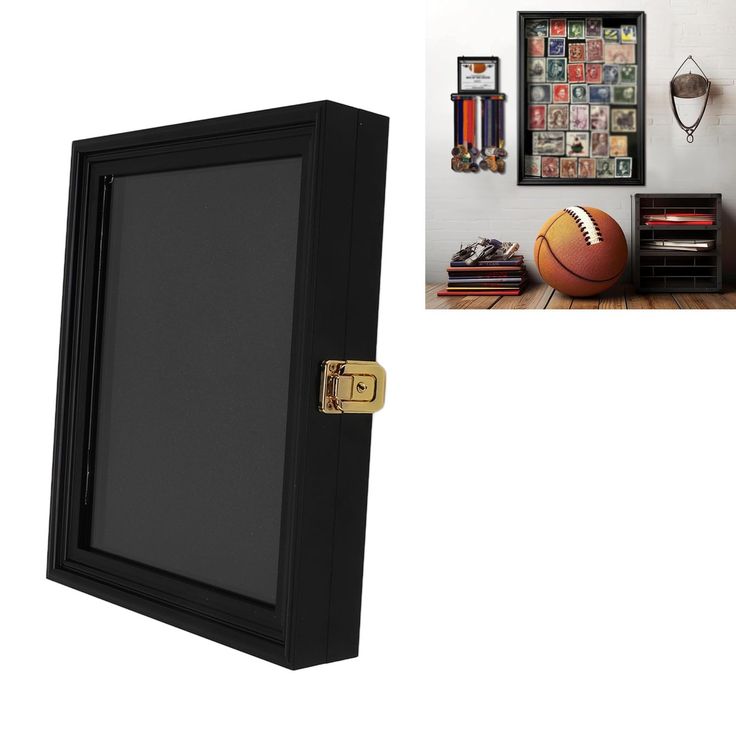 a door is open to reveal a basketball on the floor next to a wall with pictures