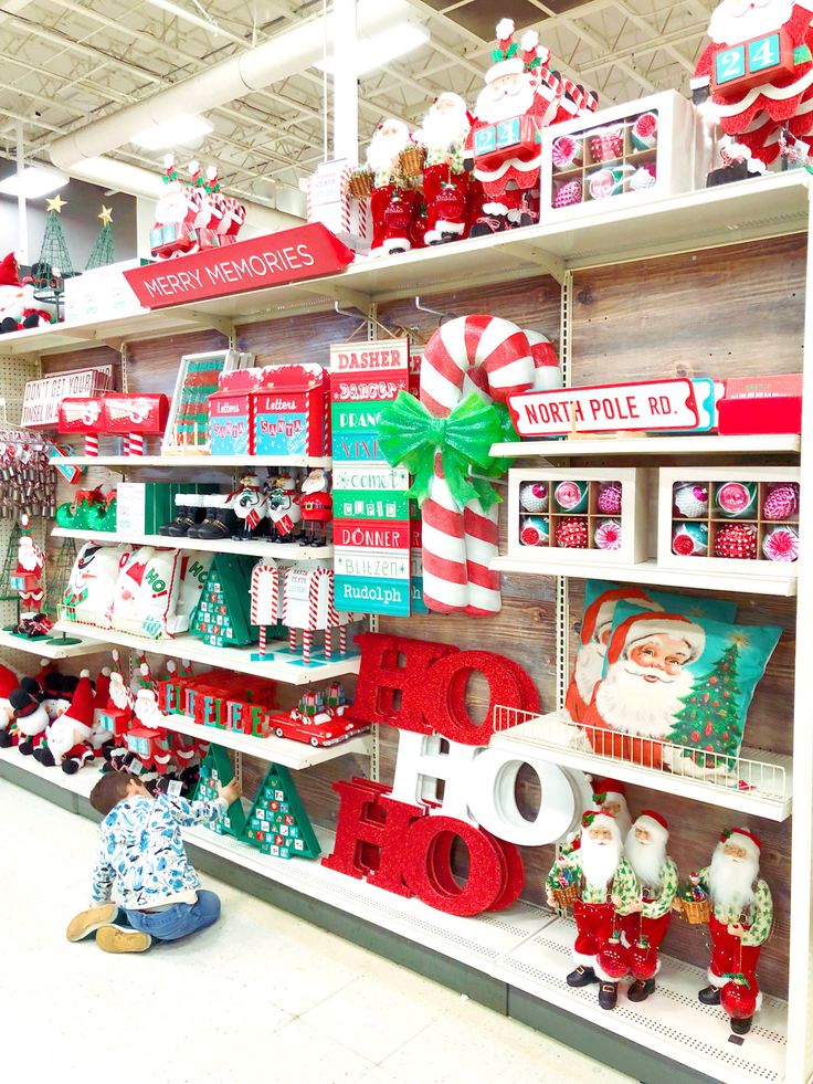 a store filled with lots of christmas decorations and candy canes on the shelves next to each other