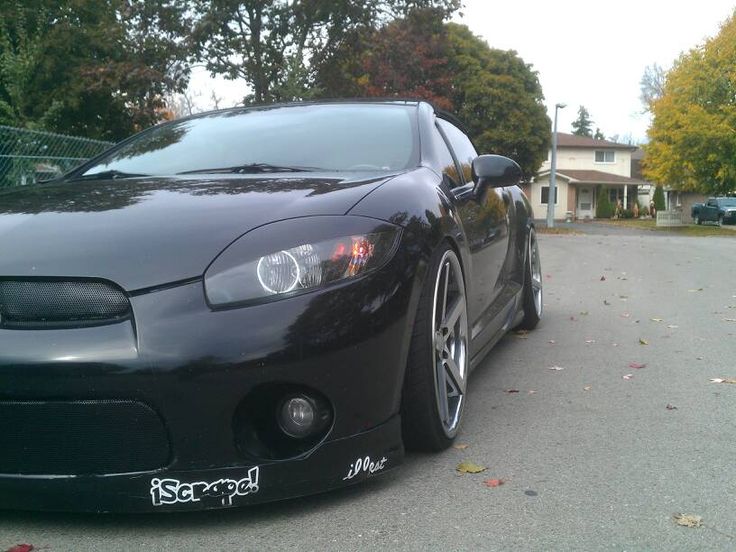 a black sports car parked on the street