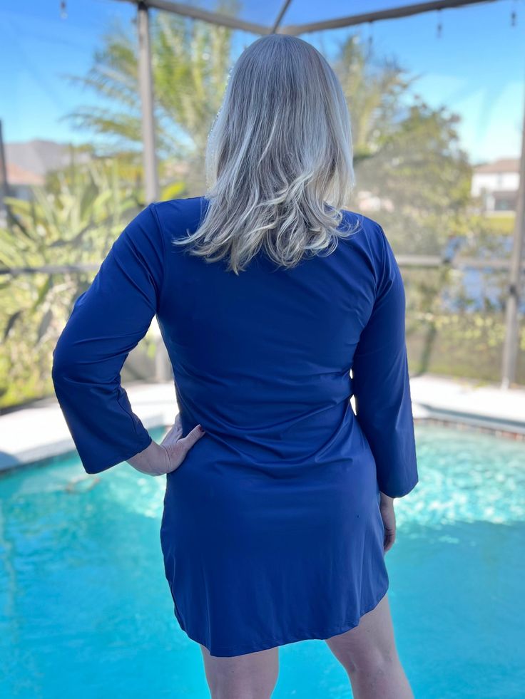 Protect your skin from the summer sun with our Seaside Beach Dress by Capelton Road. This beautiful dress features UV protection and a bold patriot blue color, perfect for any beach day. Stay stylish and safe all season long. 88% Nylon 12% Spandex UPF 50+