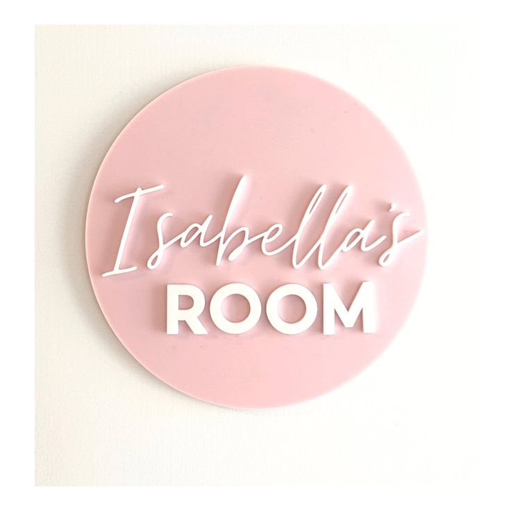 a pink circular sign that says, i ambella's room on the wall