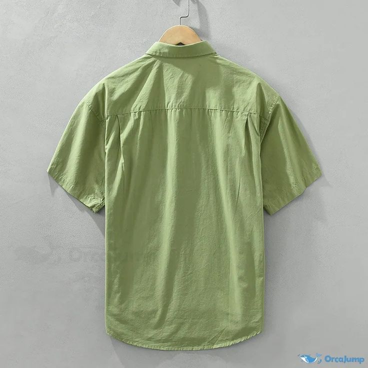 OrcaJump - Classic and Fashionable Short-Sleeve Cotton Shirt in Solid Color for Casual and Stylish Looks Khaki Short Sleeve Top With Pockets, Casual Khaki Cotton Shirt, Casual Khaki Tops With Pockets, Collared Cotton Shirt In Solid Color, Khaki Cotton Button-up Top, Khaki Solid Color Short Sleeve Tops, Khaki Short Sleeve Top, Green Casual Short Sleeve Shirt With Pockets, Casual Green Short Sleeve Shirt With Pockets