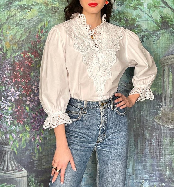 * Follow our journey on Instagram @anthophile_vintage or visit our website anthophilevintage.com (10% off on your first order) *  Stunning Exclusiv romantica Peter Hahn vintage white blouse with lace embroidery front. Fits sizes Medium - Large, depending on the desired fit. - Excellent condition - 100% Cotton - One-sided measurements: bust: 56cm, waist: 41cm, sleeves: 48cm, length: 64cm - Wash at or below 30oC Vintage White Blouse, Ballet Competition, Womens Blouses, Cotton Vest, Lace Embroidery, Our Journey, Long Blouse, White Blouse, Lace Blouse