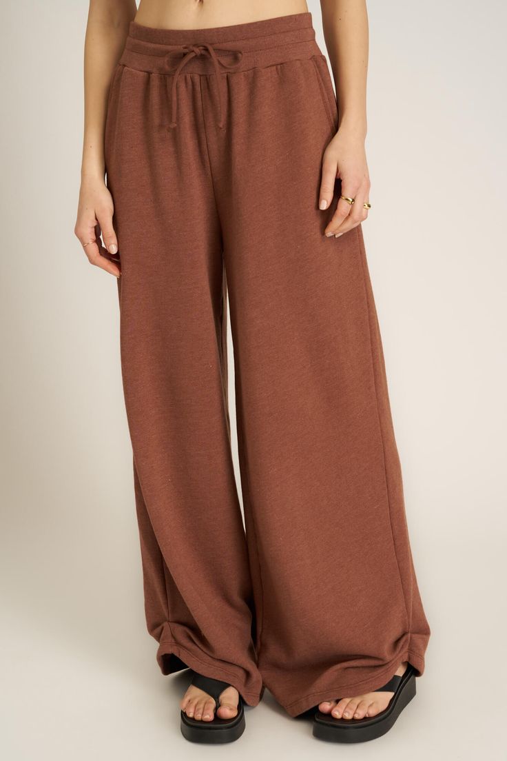 Step up your matching sets game.The Nigel Pleated Wide Leg Pant features a wide leg silhouette with an elasticized waist and a functional drawcord. These pants offer both comfort and versatility while the ruche detailing on the ankles adds a touch of refinement to the relaxed fit. Pair with the Nigel Slouchy Jacket for a coordinated look that’s effortlessly cool and stylish. 61% Cotton39% Polyester Care Instructions: Machine wash cold. Wash inside out with similar colors. Do not bleach. Lay flat Wide-leg Lounge Pants With Drawstring, Wide-leg Loungewear Bottoms With Elastic Cuffs, Versatile Wide Leg Pull-on Pants For Loungewear, Versatile Lounge Pants With Elastic Cuffs, Versatile Loungewear Pants With Elastic Cuffs, Versatile Loungewear Bottoms With Elastic Cuffs, Comfortable Wide Leg Pants With Drawstring, Brown Wide Leg Pants With Drawstring, Wide-leg Pants With Drawstring