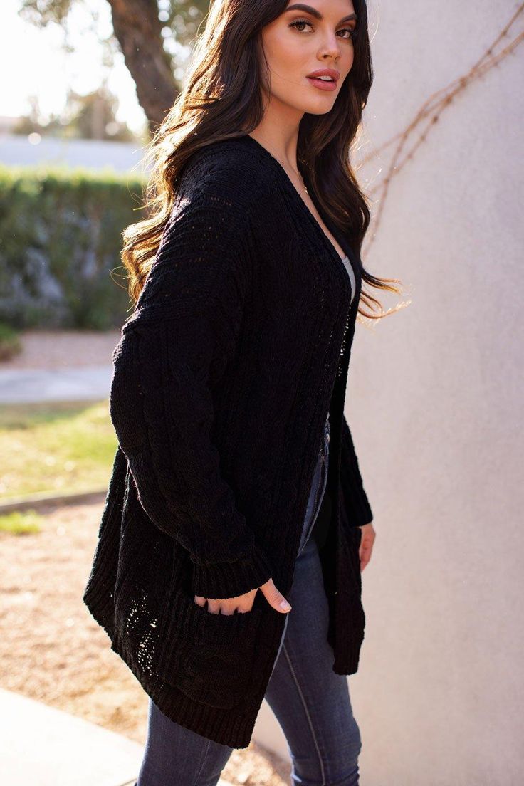 Serene Black Cable Knit Cardigan Black V-neck Cozy Sweater Coat, Black Textured Knit Winter Cardigan, Black Textured Knit Cardigan For Winter, Black Textured Knit Long Sleeve Cardigan, Cozy Black Sweater For Spring, Black Chunky Knit Outerwear For Spring, Cozy Black Spring Sweater, Black Soft Knit Long Sleeve Cardigan, Black Soft Knit Outerwear For Spring