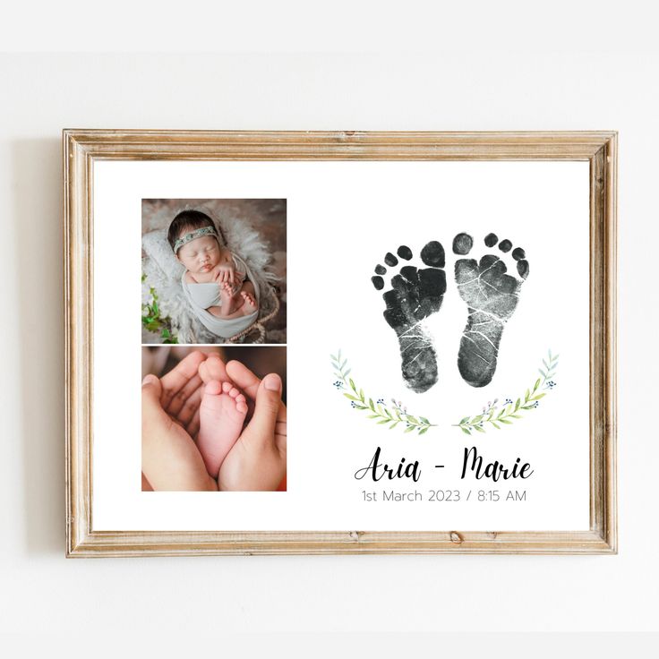 a baby's hand and foot prints are displayed in a wooden frame