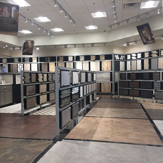 a large room filled with lots of different types of tiles and floor coverings on the walls