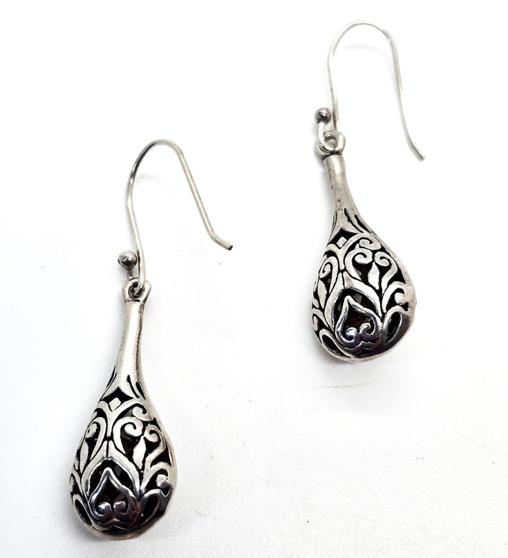 Filigree drop open work tribal Bali Balinese style sterling silver vintage drop earrings. Good vintage condition with little to no signs of normal vintage wear. Great patina present. Acid tests positive for sterling silver. Earrings measure 1 and 3/4ths of an inch tall and 1/2 of an inch wide. Silver Traditional Teardrop Earrings With Intricate Design, Traditional Silver Drop Earrings, Traditional Silver Teardrop Earrings With Intricate Design, Traditional Silver Teardrop Pierced Earrings, Traditional Silver Teardrop Earrings, Silver Teardrop Earrings With Intricate Design, Traditional Sterling Silver Teardrop Earrings, Handmade Traditional Silver Teardrop Earrings, Traditional Handmade Silver Teardrop Earrings