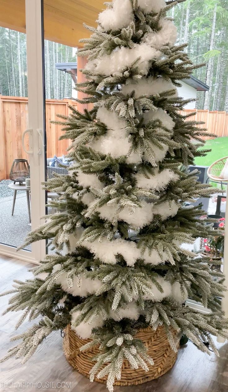 a small christmas tree with snow on it