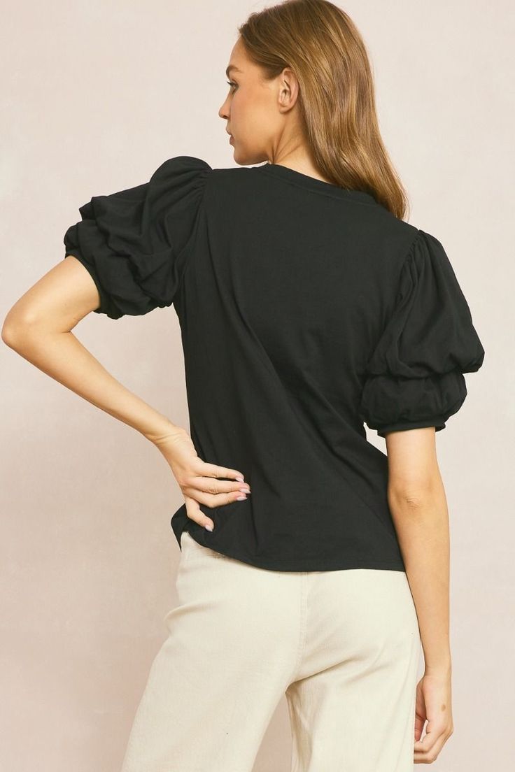 Black blouse with ruched puff sleeves Make a statement with this ultra chic black top! Featuring fun ruched puff short sleeves and a classic crew neckline, you'll be looking and feeling fabulous. Make your friends puff up with envy! Perf for the upcoming seasons, just grab your fave pants and shoes for the cutest outfit!! True to size fit Model is 5'10" wearing a small Fabric contains stretch Crew neckline Ruched puff short sleeves Unlined, non-sheer, lightweight Small length: 24" from top of sh Trendy Puff Sleeve T-shirt For Fall, Fitted Puff Sleeve T-shirt, Fall Tops With Gathered Short Sleeves, Fall Short Sleeve Tops With Gathered Sleeves, Trendy Puff Sleeve Top For Fall, Trendy Puff Sleeve Short Sleeve Top For Fall, Trendy Solid Tops With Gathered Sleeves, Trendy Short Sleeve Puff Sleeve Top For Fall, Summer Crew Neck Top With Gathered Sleeves