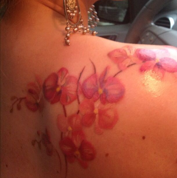 a woman with flowers painted on her back