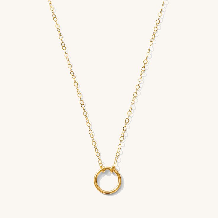 The circle is symbolic in many ways - representing karma, wholeness, eternity, and self. We love its significance as much as we love its appearance on the neck. This piece is the perfect gift for anyone in your life. 14k Gold Fill Length: 16" Everyday Yellow Gold Circle Charm Necklace, Circle Cable Chain Necklaces For Gifts, Dainty Yellow Gold Open Circle Necklace, Minimalist Halo Round Pendant Jewelry, Minimalist Halo Necklace, Circle Charm Necklace In Yellow Gold Sterling Silver, Minimalist Circle Cable Chain Jewelry, Everyday Circular Yellow Gold Necklace, Everyday Yellow Gold Circular Necklace