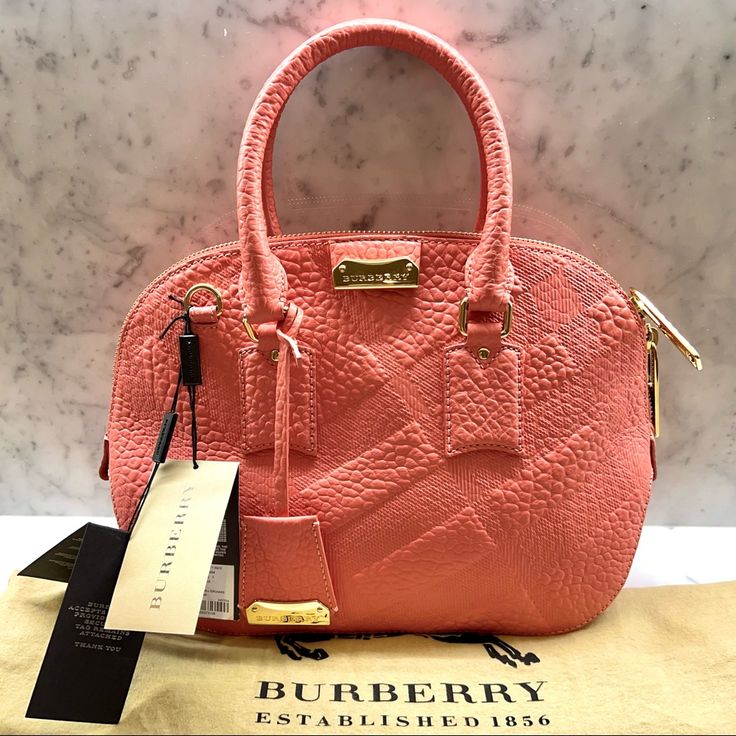 Burberry Check Small Orchard Bag - New With Tags And Dust Bag - Color: Rose Pink - Dimensions: 12”L X 9.75”H X 3.75”W - Burberry Check Grained Leather - Double Zip Closure - Removable Adjustable Shoulder Strap - Gold Hardware - Inner Pocket With Zip Closure - Two Open Inner Pockets Reasonable Offers Only Please! Luxury Pouch Satchel With Handles, High-end Pink Satchel With Detachable Handle, High-end Pink Top Handle Satchel, High-end Pink Bag With Handles, Luxury Pink Pouch-shaped Satchel, Luxury Pink Pouch Satchel, High-end Pink Bags With Gold-tone Hardware, Designer Pink Satchel For Formal Occasions, Designer Pink Bag For Formal Occasions