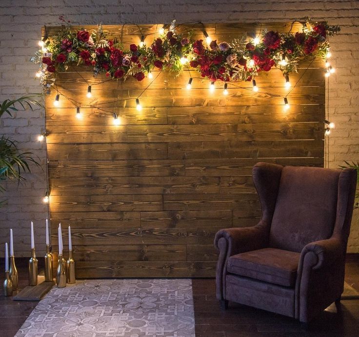 a living room filled with furniture and christmas lights