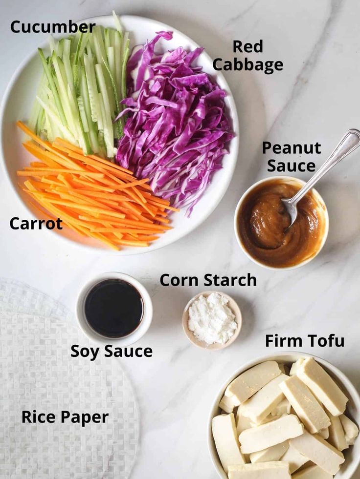 the ingredients to make this salad include carrots, celery, red cabbage, cucumber, peanut sauce, carrot slices and corn starch