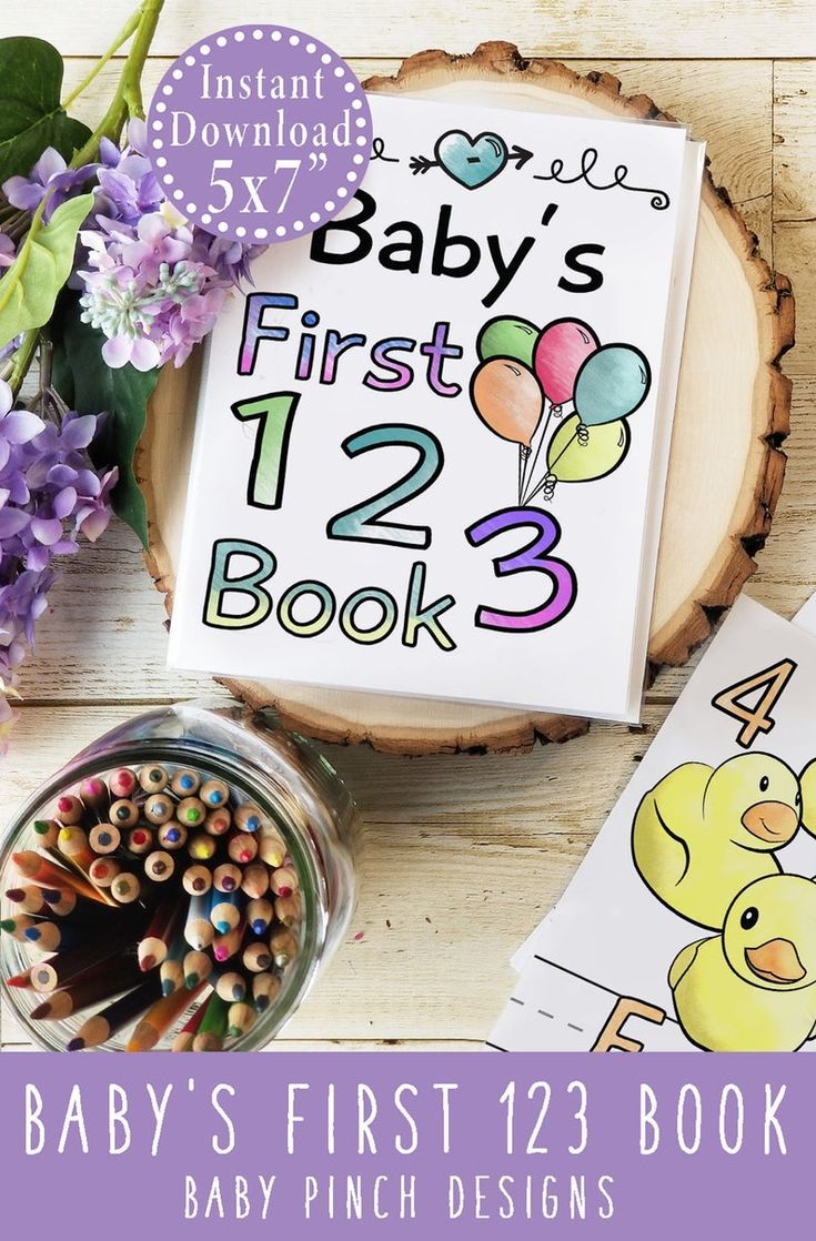 the baby's first 123 book is next to some crayons and flowers