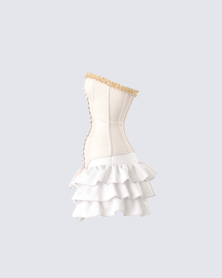 Get ready for a day full of being the center of attention 😌 Pairing an ivory canvas lace up corset top with a ivory ruffle mini skirt, this two-piece fit will have all eyes following your every move 🤍 Elegant Spring Corset Dress With Ruffle Hem, Fitted Mini Dress With Ruffles And Tiered Skirt, Party Mini Length Ruffled Corset, Summer Corset Dress With Ruffled Skirt, White Ruffled Mini Skirt For Party, Beige Party Skirt With Ruffles, White Ruffled Party Skirt, Feminine Ruffled Corset, White Ruffled Skirt For Party