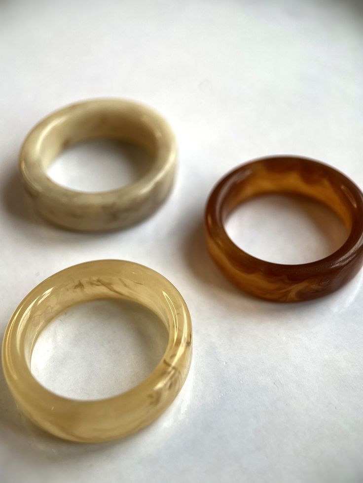 "Complete your perfect look with the acrylic resin rings from Vielring. These beautiful plastic rings belong to our adjustable ring category. They are adjustable in size and can be customised. The perfect gift for you or one of your loved ones.♡ ∙Shipping is free of charge within Germany and will be shipped within one working day. - Material: plastic, acrylic resin - Dimensions: ~ 17 mm - All our items are made by hand, with love and care.♡ ∙Packaging∙ - All orders are packed by us in a high quality \"multi-ring\" jewellery bag.♡ ∙More from us∙ https://www.etsy.com/de/shop/Vielring ∙Social Media∙ - Instagram: https://www.instagram.com/vielring - Facebook: https://www.facebook.com/vielring - Pinterest: https://www.pinterest.de/Vielring/_shop - TikTok: https://www.tiktok.com/@vielring Thank Vintage Resin Rings For Gifts, Handmade Vintage Resin Rings, Clear Resin Rings, Trendy Plastic Rings As Gifts, Trendy Clear Round Rings, Clear Plastic Jewelry For Gifts, Clear Plastic Jewelry As A Gift, Clear Plastic Jewelry Gift, Vintage Plastic Jewelry For Gifts