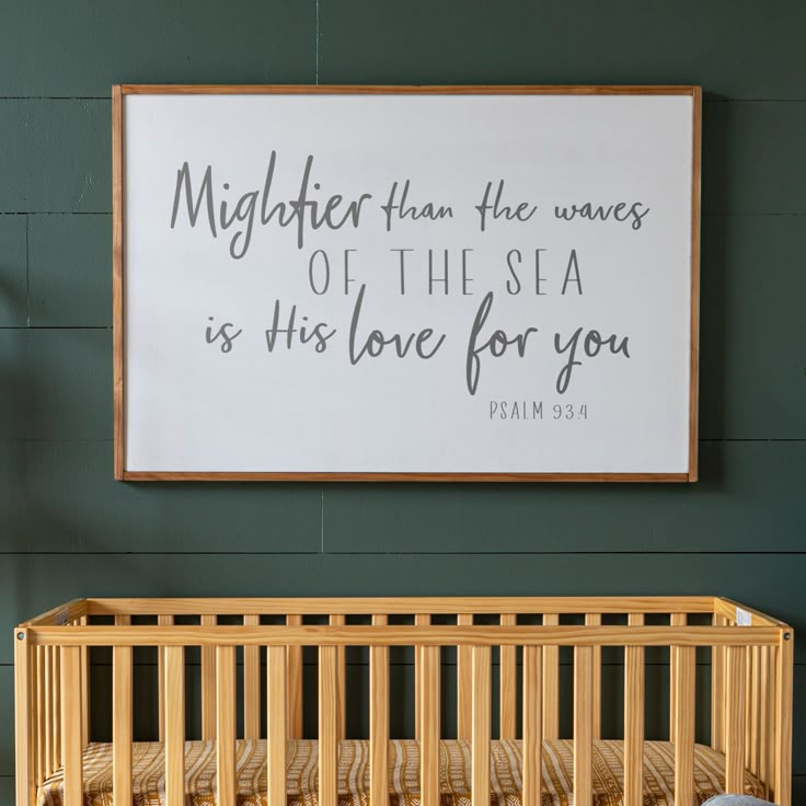 a baby crib with a sign above it that says, mightier than the waves of this sea is his love for you