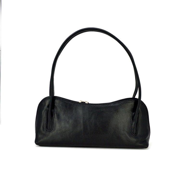 Modern yet timeless, this structured shoulder bag finishes off just about any ensemble in your closet. The perfect in-between size carry-all, big enough to carry all your essentials, small enough to keep you light and carefree. Eco-Friendly Vegetable Tanned Top Grain Leather Made in Florence, Italy 13" height with strap, 5" height without strap x 12" width Two-way outside zipper Fabric Lining One inside zipper Chic Everyday Vegetable-tanned Shoulder Bag, Vegetable-tanned Leather Shoulder Bag, Everyday Vegetable-tanned Leather Shoulder Bag, Vegetable-tanned Leather Satchel Shoulder Bag, Elegant Vegetable-tanned Leather Shoulder Bag, Black Honey, Tan Top, Italian Decor, Orange Leather