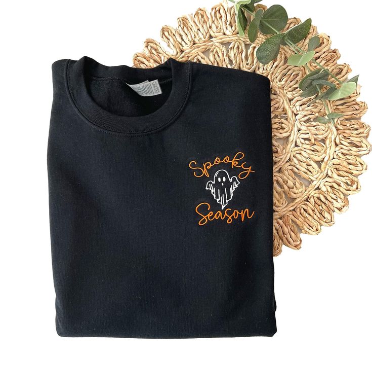 Our new Spooky Season Halloween Sweatshirt is the perfect addition to your Fall and Halloween wardrobe. This embroidered sweatshirt is professionally embroidered and will definitely get you excited for Fall and Halloween!  Professionally embroidered with left chest placement.  Sweatshirt is a 8 oz. 50/50 cotton/polyester blend fleece Spooky season will be embroidered with our premium orange thread. The ghost will be embroidered with black thread on the following colors - White, Sand, Light Blue, Embroidered Halloween, Halloween Sweater, Women Sweatshirt, Womens Sweatshirts, Sweatshirt Halloween, Sweatshirt For Men, Sweatshirt For Women, Black Thread, Embroidered Sweatshirt