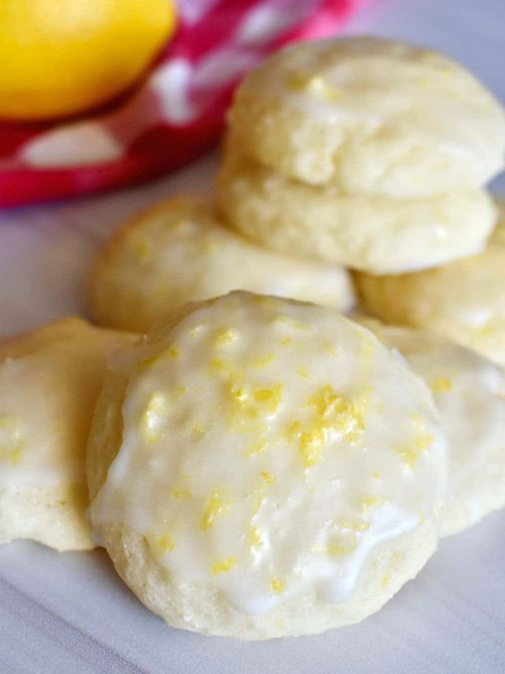 lemon cookies with white icing on a table