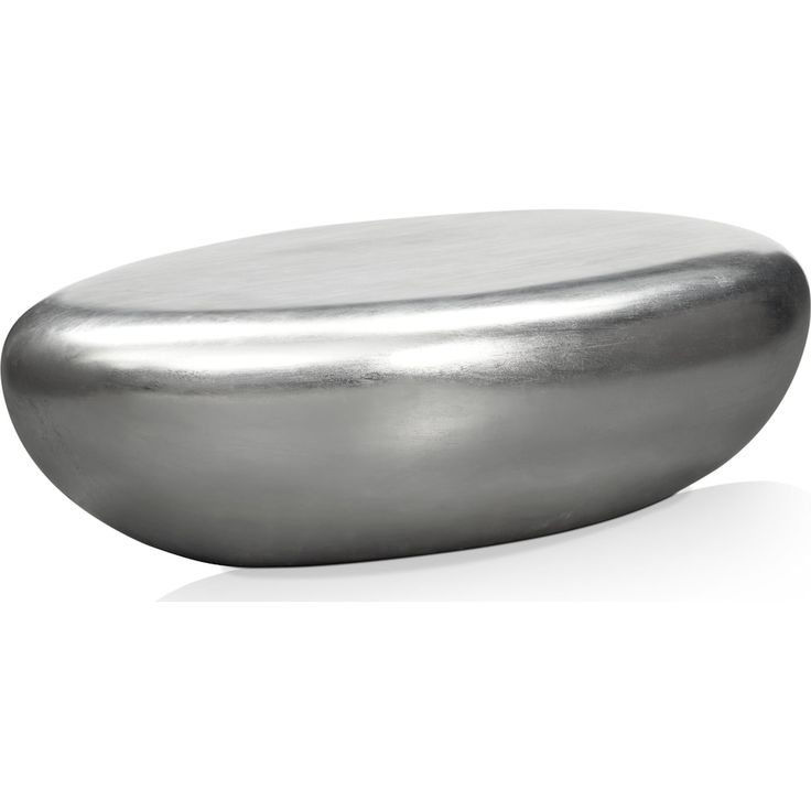 a round metal object sitting on top of a white surface