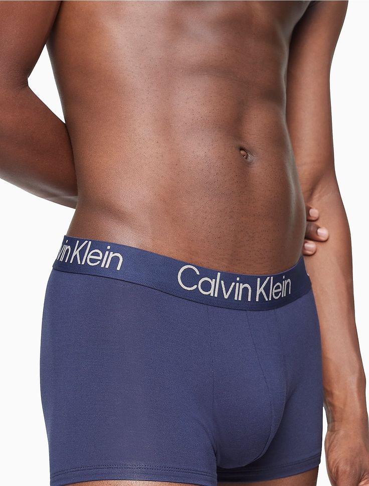 Eco-conscious with a luxurious feel, these Calvin Klein trunks are crafted from sustainably sourced modal with added breathability and long lasting fibers. Designed with a super soft recycled logo waistband, a sleek contoured pouch and a turnback hem for a clean finish. Comes in a 3-pack.  Material: 90% Modal, 10% Elastane. Recycled Logo, Calvin Klein Boxer Briefs, Recycle Logo, Outfits Hombre, Breathe Easy, Eco Conscious, Trunk, Calvin Klein, Long Lasting