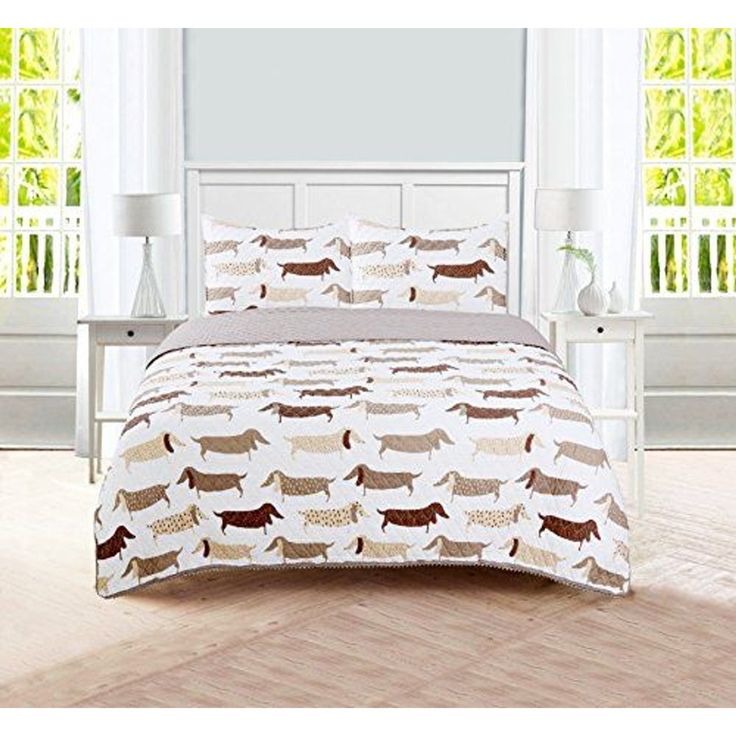 a bed with a white headboard and brown dachshund bedspread