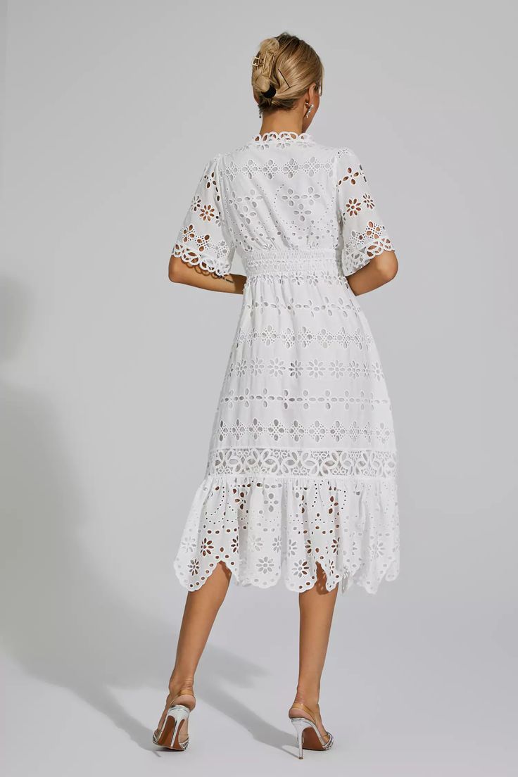 This elegant Aarya White Cut Out Midi Dress is a fusion of French styling and summer fashion. The dress features intricate embroidery and delicate lace detailing, adding a touch of sophistication. With its mid-length design and white color, this dress is perfect for any occasion. Step out in style and make a lasting impression with this beautiful dress.  Dress Length: Approx 128cm Materials: Polyester Gentle Dry Clean Only  The model is 5 ft 7 and wears size S  Color may vary due to lighting on Silver Sequin Top, Glitter Wedding Dress, Cut Out Midi Dress, Costura Fashion, Total White, Bandage Midi Dress, Floral Shirt Dress, Intricate Embroidery, Puff Sleeve Dresses