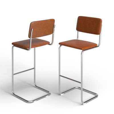 two brown chairs sitting next to each other on a white surface with one chair facing the other