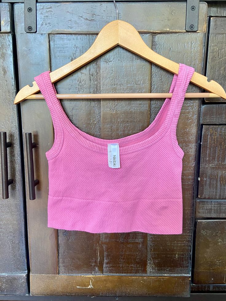 It's back!! The cutest NIKIBIKI ribbed tank in the most popular color of the summer. Grab yours today before they are gone again! 92% Nylon, 8% Spandex Made in USA Pull On closure MULTI-PURPOSE WEAR – Our ultra soft, well-fitting, and versatile tops are perfect for any season, setting, and occasion. Whether you’re dressing for casual occasions or fancy nights out, we guarantee our classic basic top will set the perfect foundation to your outfit. BUTTERY SOFT, PEACHSKIN FEEL – Nikibiki’s bold, li Spring Seamless Tank Top For Loungewear, Solid Spring Tank Top With Seamless Design, Seamless Tank Top For Spring, Casual Spring Tank Top With Seamless Design, Casual Seamless Tank Top For Spring, Trendy Pink Seamless Tank Top, Summer Scoop Neck Top With Seamless Design, Summer Seamless Scoop Neck Top, Seamless Scoop Neck Summer Top