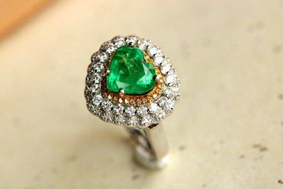 •Condition: Brand new•Center Stone: Natural Emerald from Colombia, Heart Cut approx 3.1ct (IF Color, 5A Color)•Side Stone: Natural White Diamond, round cut (VS1 clarity and F color) •Gold Weight: 4.76g•Ring and pendent two in oneEach piece is made-to-order with care and special attention to detail. all items are made with conflict-free diamonds and gems.Size: made to orderThe item will be gift wrapped and shipped.---------------------------------------------------------Available in :14k Rose or Elegant Heart-shaped Emerald Ring, Elegant Heart Cut Emerald Ring, Engagement Ring Emerald, Handmade Gold Ring, Traditional Engagement Rings, Ring Emerald, Emerald Pendant, Emerald Engagement, Emerald Engagement Ring