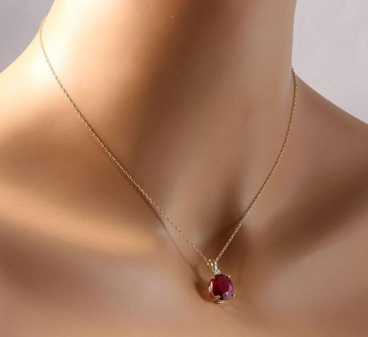 6.70Ct Natural Red Ruby and Diamond 14K Solid Yellow Gold Necklace Amazing looking piece! Stamped: 14K Suggested Replacement Value: $1600 Natural Oval Cut Ruby Weights: 6.70 Carats Ruby Measures: 12 x 10mm Total Natural Round Diamond weights: 0.05 Carats (H / SI2) Total Chain Length is 18 inches Pendant measures: 22.3 x 9.77mm Total item weight is: 3 grams Disclaimer: all weights, measurements and colors are approximate and may vary slightly from the listed dimensions or as seen in the image. Al Elegant Ruby Briolette Necklace, Party 14k Gold Gemstone Jewelry, 14k Gold Gemstone Jewelry For Parties, Party Jewelry In 14k Gold With Gemstones, Party Jewelry With Gemstones In 14k Gold, Elegant Red Round Jewelry, Elegant Yellow Gold Ruby Necklace, Elegant Red 14k Gold Jewelry, Exquisite Round Ruby Necklaces