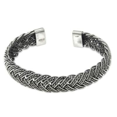 Sterling strands intertwine in a delightful silver bracelet. Braided by hand this cuff from Komang Wijayana is a modern classic. .925 Sterling silver Bohemian Sterling Silver Cuff Bracelet With Jubilee Design, Classic Silver Adjustable Braided Bracelets, Adjustable Silver Jubilee Bracelet Bangle, Braided Sterling Silver Bracelet, Elegant Sterling Silver Braided Bracelet, Formal Adjustable Braided Bracelets, Formal Adjustable Braided Bracelet, Silver Sterling Braided Bracelets, Elegant Braided Sterling Silver Bracelet Gift