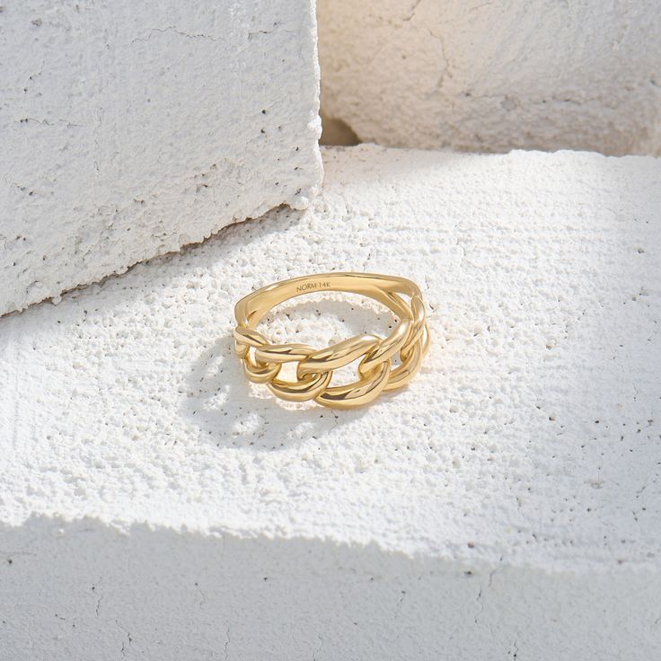 Make a bold statement with 14k real yellow gold Cuban Chain Statement Ring. This striking piece is perfect for those who seek for a conversation starter jewelry. Elegant Tarnish Resistant Link Chain Ring, Elegant Tarnish-resistant Link Chain Ring, Trendy Chain Rings In Metal, Trendy Metal Chain Rings, Tarnish Resistant Metal Chain Ring, Gold Chain Link Ring Made Of Metal, Gold Metal Chain Link Ring, Modern Chain Ring For Formal Occasions, Trendy Open Ring With Adjustable Chain