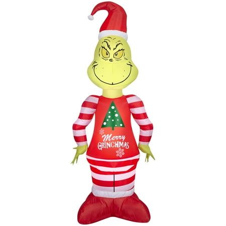 an inflatable christmas decoration with a grin face