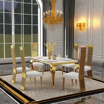 a dining table with chairs and a chandelier