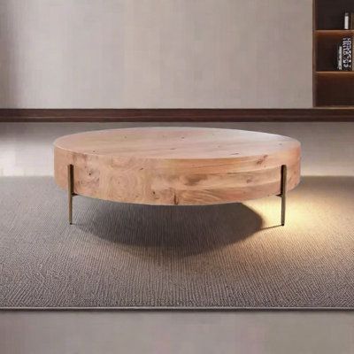 a wooden table sitting on top of a carpeted floor