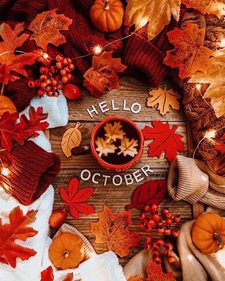 an autumn wreath with pumpkins, leaves and other fall decorations on the side that says hello october