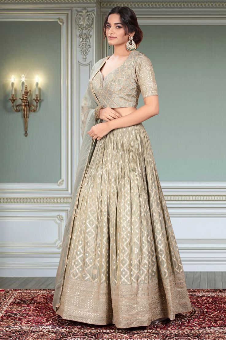 This Party Wear Lehenga D-345 features stunning gold embroidery, adding an elegant touch to any event. Expertly crafted, this traditional garment showcases intricate detailing and timeless style. Perfect for special occasions, this lehenga is sure to make a statement. Elegant Embroidered Choli With Traditional Drape, Elegant Sharara With Gold Embroidery In Traditional Drape, Elegant Sharara With Gold Embroidery And Traditional Drape, Designer Gold Anarkali Set With Intricate Embroidery, Elegant Sharara With Gold Embroidery For Festive Occasions, Elegant Sharara With Gold Embroidery, Elegant Festive Sharara With Gold Embroidery, Formal Lehenga With Resham Embroidery In Art Silk, Formal Art Silk Lehenga With Zari Work